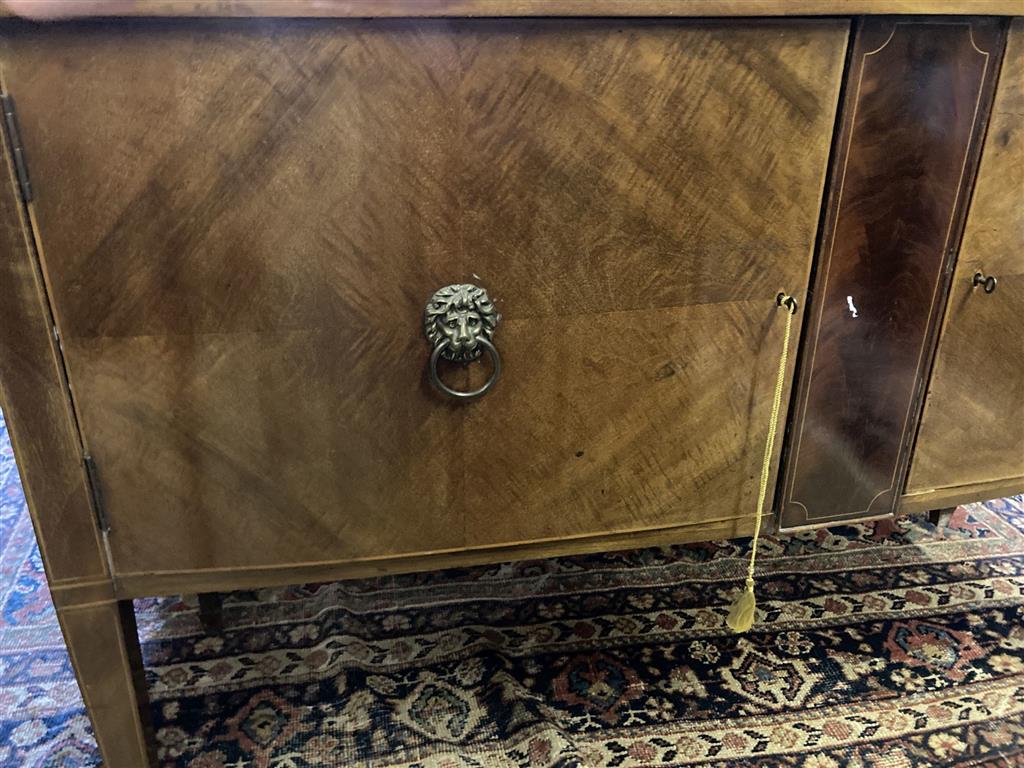 An Edwardian mahogany bow fronted sideboard, length 137cm, depth 60cm, height 91cm